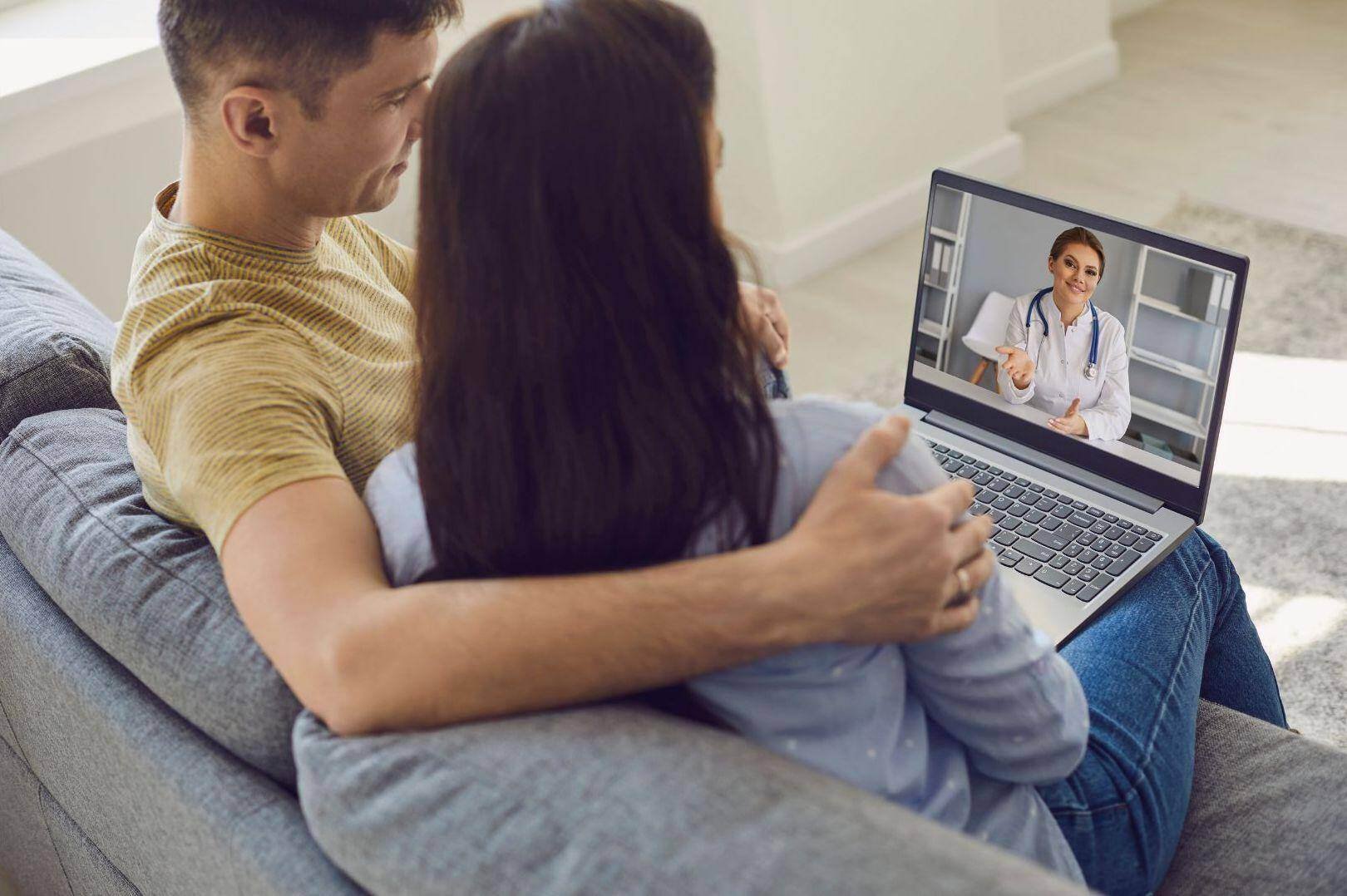 A couple having a digital consultation with an accident doctor in Lakewood, Ohio