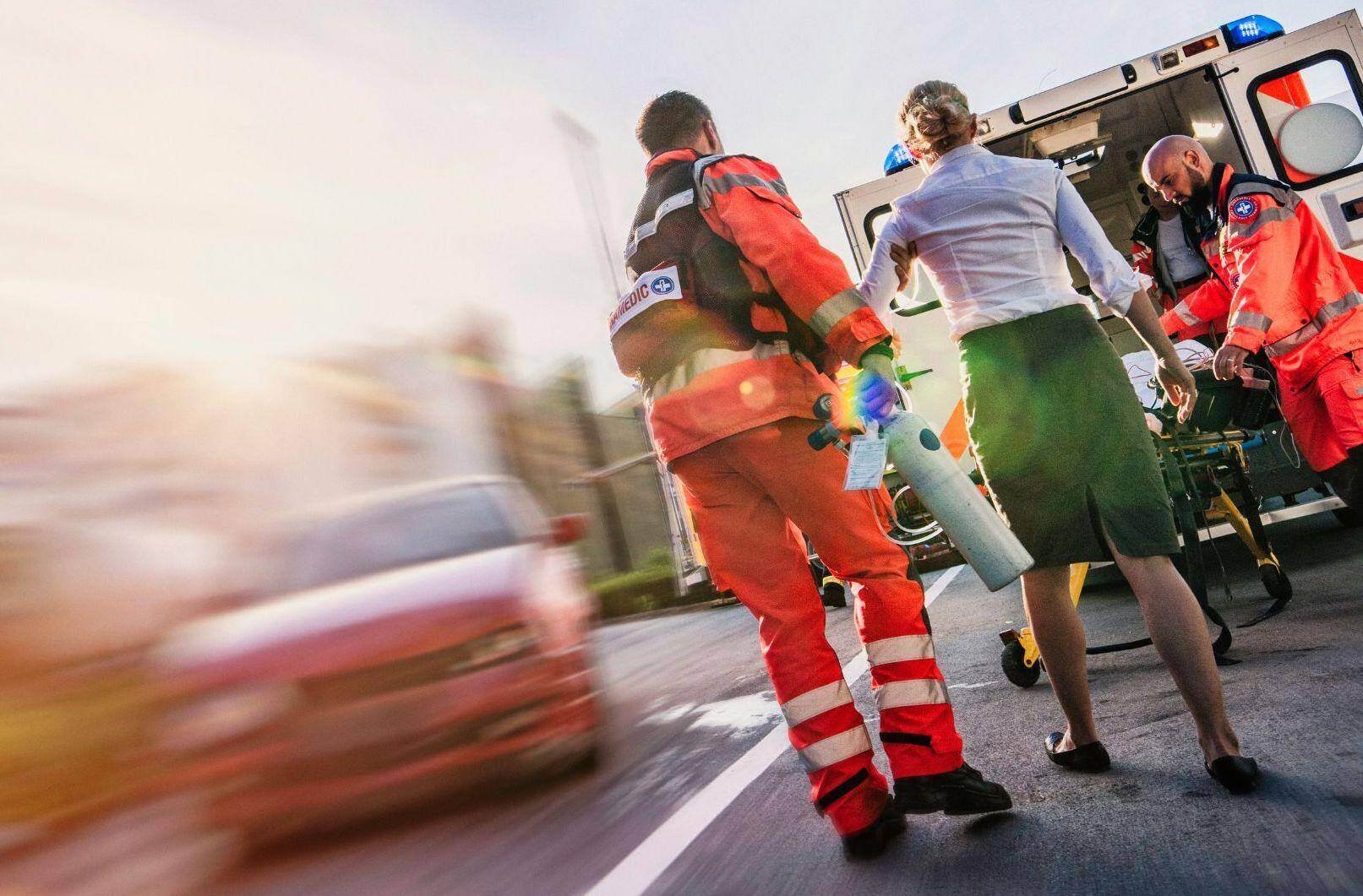 First responders helping car accident victim after an accident in Saraland, Alabama