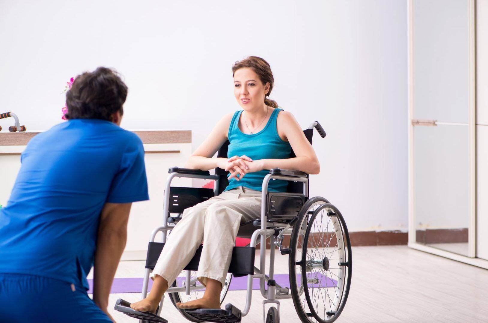 A patient in a wheel chair goes through physical therapy after a car accident in Surprise, Arizona