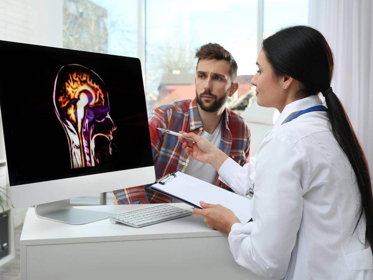 Austin Neurologist assessing a brain scan in Austin, Texas