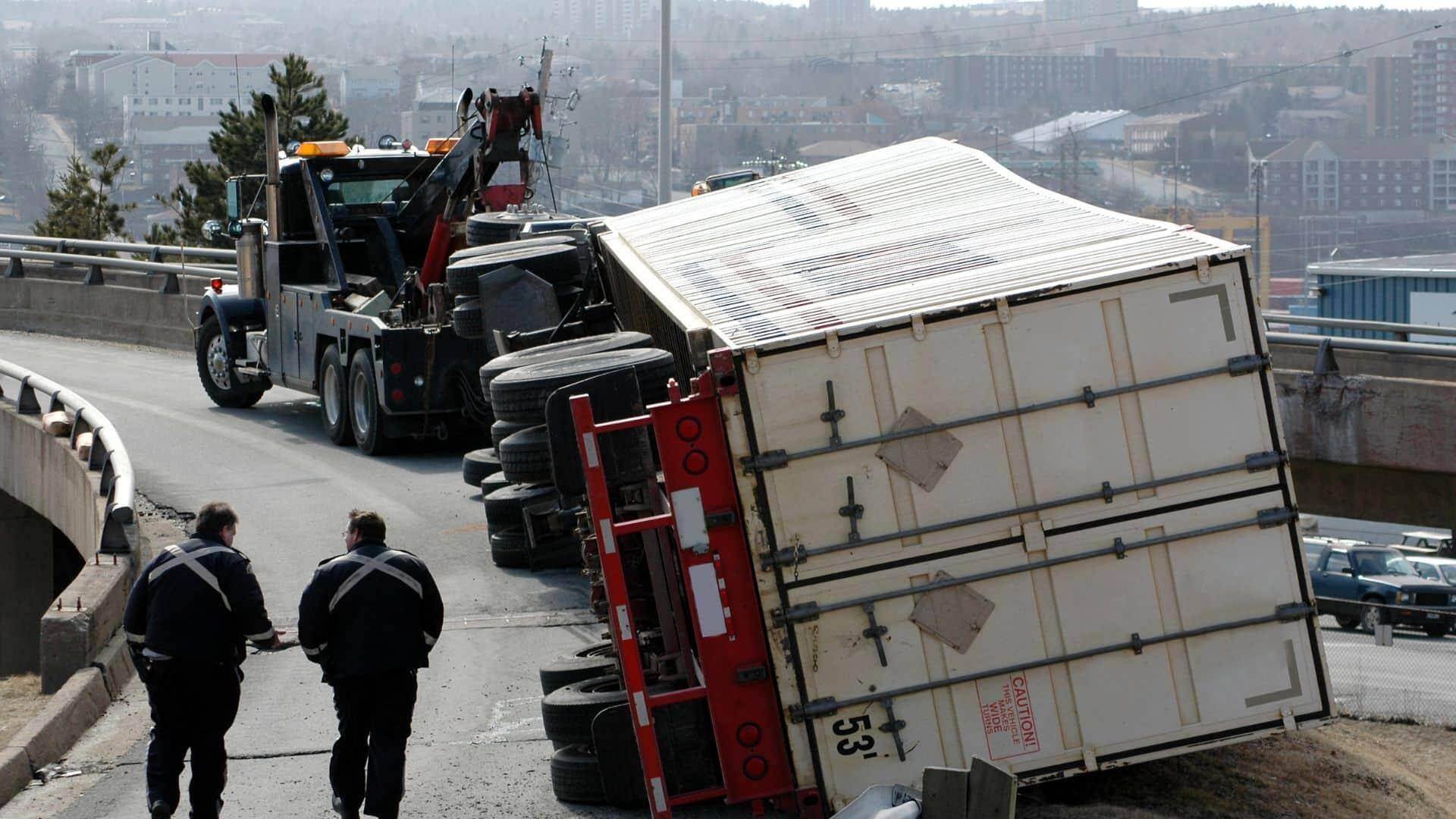 truck-knocked-over-after-trying-to-make-a-turn-blocking-the-streen-for-Helping-The-Hurt-in-medford-massachusetts